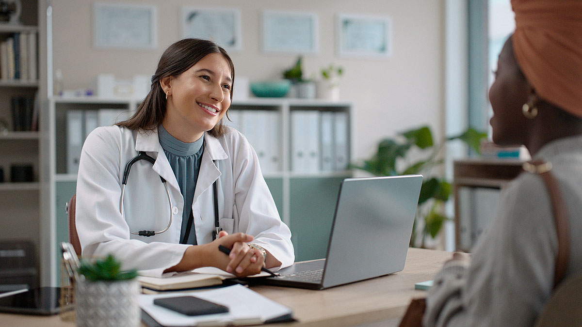 hill-physicians-serving-physicians-proud Female physician and patient